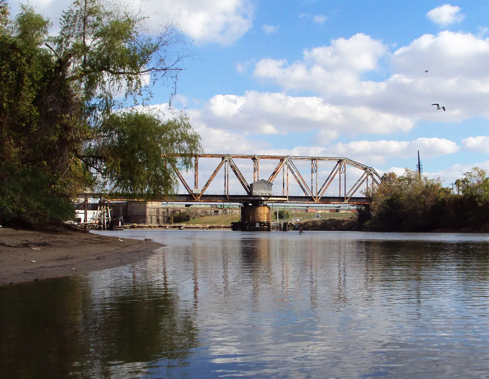 A historic railroad swing bridge over Buffalo Bayou.