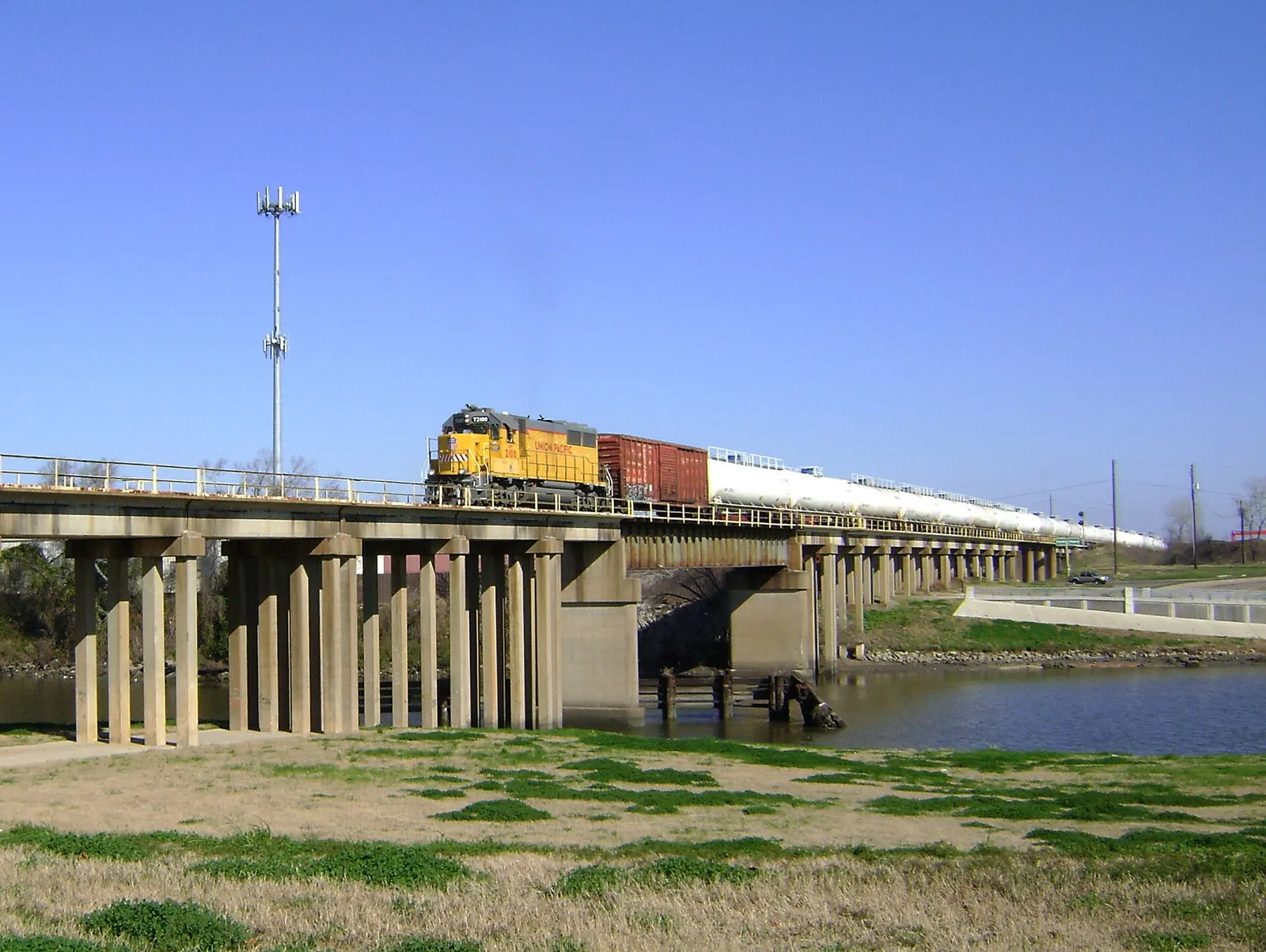 A railroad bridge over Brays Bayou near Harrisburg Boulevard.