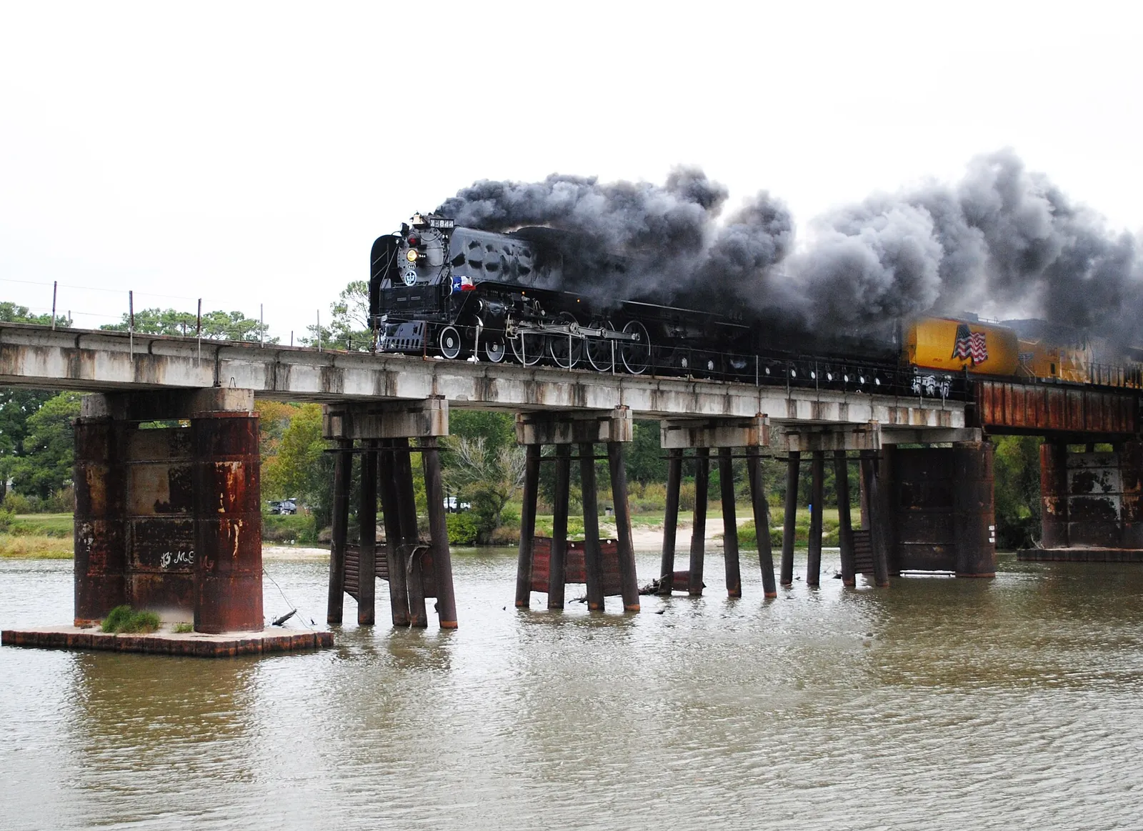 A steam train crossing the San Jacinto River bridge at Kingwood.